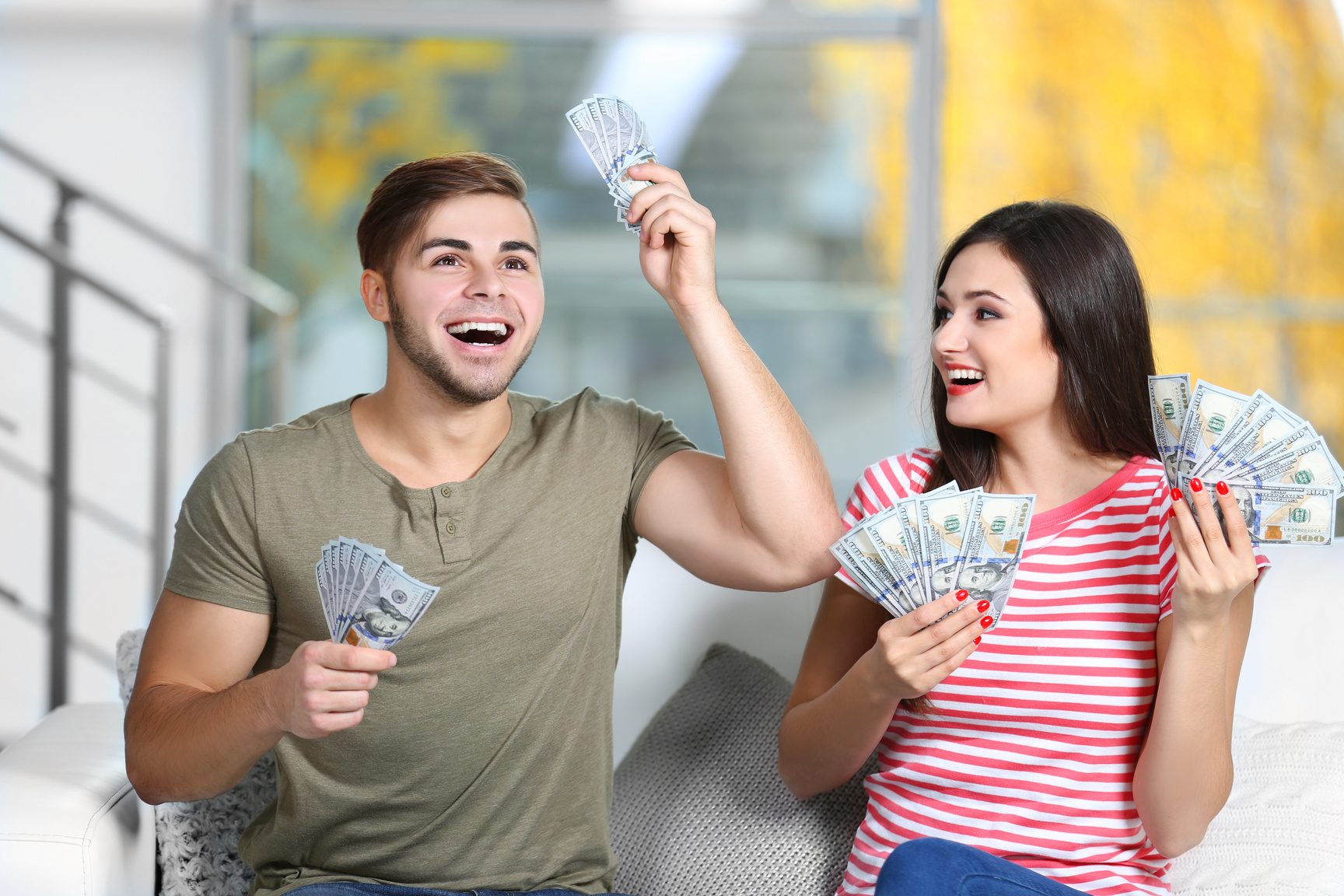 Happy Couple with Money from the Moneybox