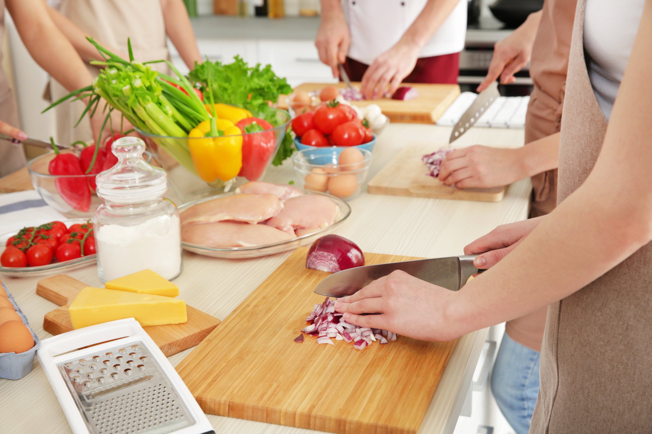 People Cutting Onion at Cooking Classes